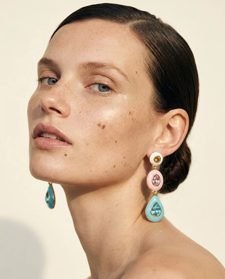 Close-up beauty portrait with layered pastel drop earrings